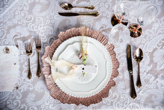 Cutlery-and-charger-plates-on-linens