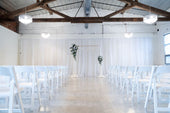 gold-archway-with-florals-and-draping