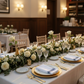 18"x22" Navy Blue Stripe Bistro Spun Polyester Napkins 5pc on top of white dinner plate, white tablecloth with flower centerpieces