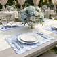 2 pcs/set French Toile Scalloped Edge Placemats Baby Blue paired with white dinner plates and blue/white floral centerpieces
