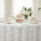 indoor bridal side table with 3D Gardenia Embroidery Sheer 120" Round Tablecloth - White