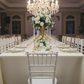 indoor wedding reception with 4 pc/set Lotus Scalloped Glass 13" Charger Plate - White Gold-Trimmed