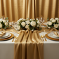 40 yds Satin Fabric Roll - Gold-Antique
used as diy table runner for wedding ceremony with flower centerpiece | gold charger plate | white dinner plate | champagne napkin | wine goblets