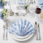 4 pcs/pk French Toile 18"x18" Scalloped Edge Napkins Baby Blue in a scallop fold on top of white dinner plates