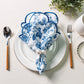 French Toile 20"x20" Scalloped Edge Napkins Blue with a gold napkin ring