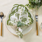 French Toile 20"x20" Scalloped Edge Napkins Olive Green with a eucalyptus napkin ring