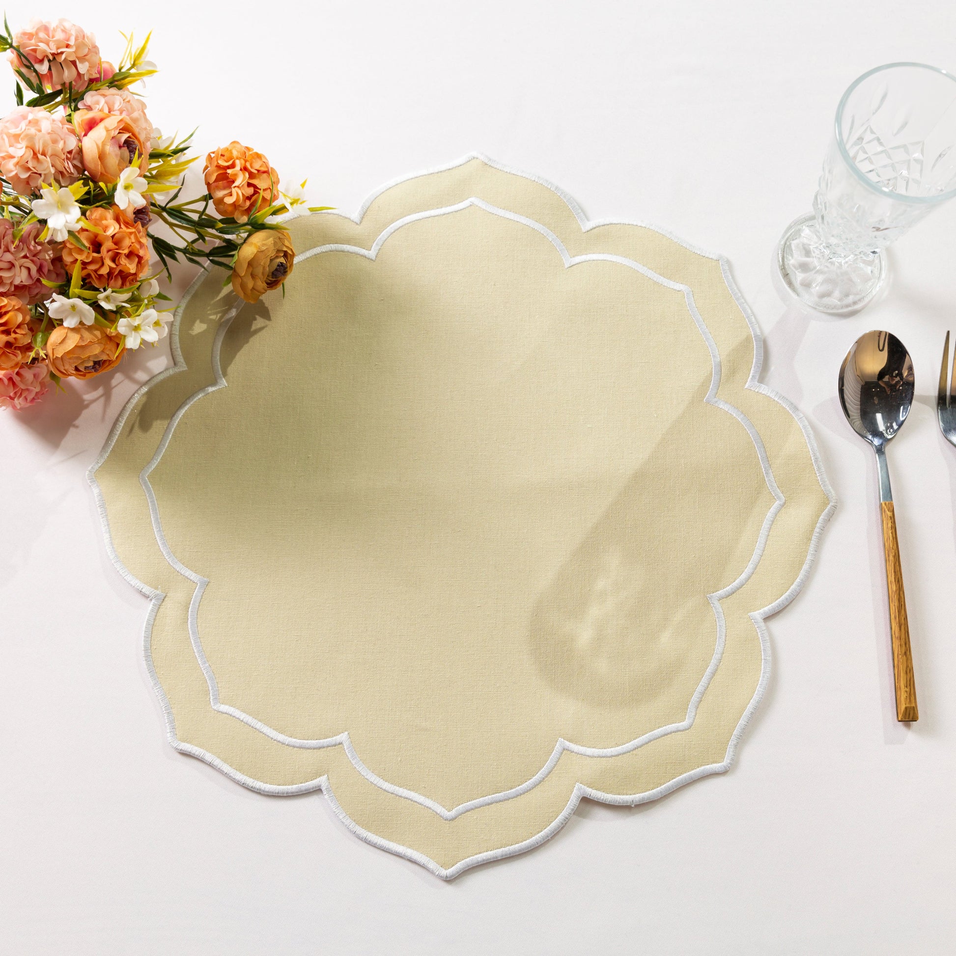 4pc/set Petal Elegance Placemats Champagne/White Trim paired with a blush tablecloth, fall florals and silverware