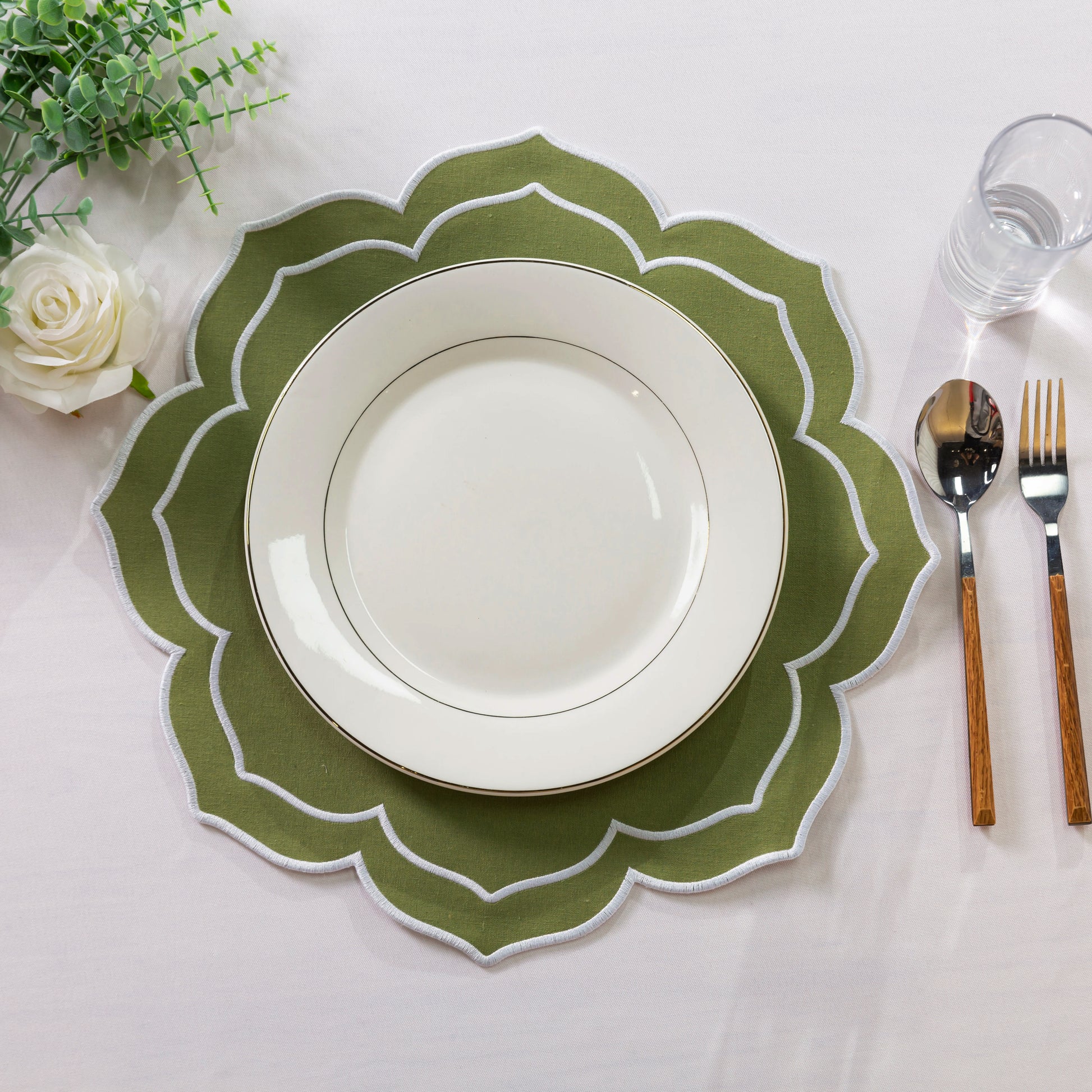 4pc/set Petal Elegance Placemats - Olive Green/White Trim paired white dinner, faux greenery, and silverware