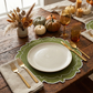 fall table decor with the 4pc/set Signature Scallop Placemats Olive Green/White Trim, burlap napkin, gold flatware, and a amber colored glassware
