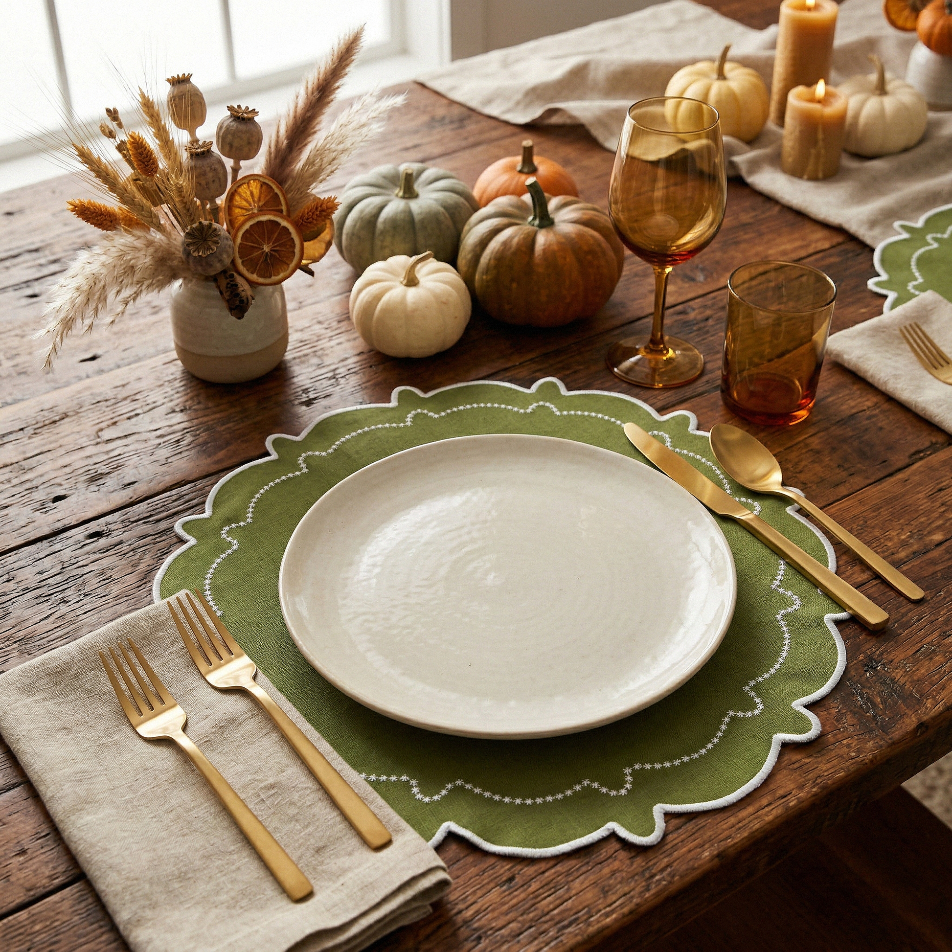 fall table decor with the 4pc/set Signature Scallop Placemats Olive Green/White Trim, burlap napkin, gold flatware, and a amber colored glassware

