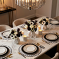4pc/set Sunburst Edge Placemats White/Black Trim paired with black charger plates and floral centerpieces
