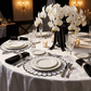 4pc/set Sunburst Edge Placemats White/Black Trim with white dinner plates, black napkins with silver napkin rings and wine glasses