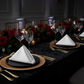 dinner setup with black tablecloth, gold charger plate and 5 pcs/pk Premium Linen-Look Panama Weave 20"x20" Napkin - White 