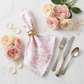 French Toile 20"x20" Linen Napkin Dusty Rose/Mauve with gold napkin ring close up