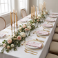 French Toile 20"x20" Linen Napkin (5pc/pk) Dusty Rose/Mauve folded on top of white dinner plates, gold silverware and gold candelabra centerpiece