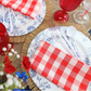 5pcs Gingham Checkered Polyester Napkin 20"x20" Red & White paired with red goblets, blue french toile charger plates, and fringed edge woven 15" placemats