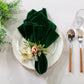 5 pcs/pk Glitter Velvet 20"x20" Linen Napkin Emerald Green paired with a white charger plate, faux floral napkin ring and silverware
