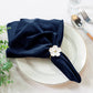 5 pcs/pk Glitter Velvet 20"x20" Linen Napkin Navy Blue paired with a flower napkin ring, white charger plate, faux greens and silverware