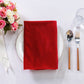 5 pcs/pk Glitter Velvet 20"x20" Linen Napkin Red folded on a white charger plate, sunflowers and silverware