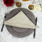 birds eye view of the Luxury Boucle 20"x20" Linen Napkin Beige on top a pattern charger plate