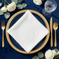 5 pcs/pk Luxury Boucle 20"x20" Linen Napkin White in a square fold with a blue dinner plate and gold charger plate

