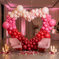 Valentine's Day 6.5ft Heart Frame Arch Backdrop with balloon garland in red, pink, cream  and pillar candles
