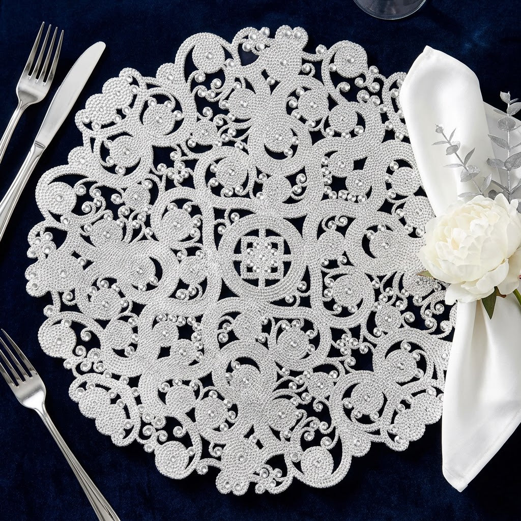 8 pc/set Filigree Acrylic Charger Plate Clear on top a navy blue tablecloth with an ivory napkin