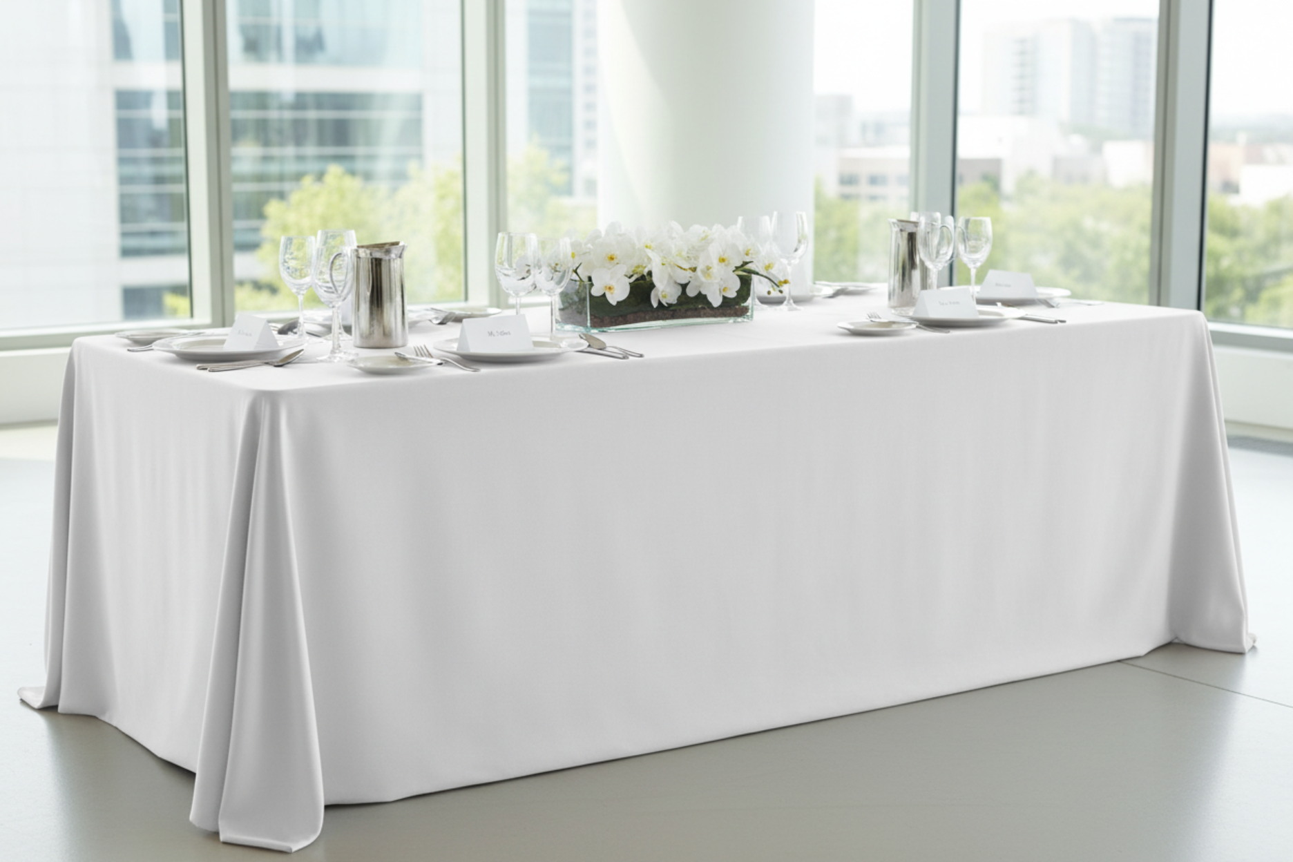 minimalist setup with 90"x132" Rectangular Premium Polyester Tablecloth (Square Corners) - White