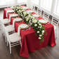 90"x156" Rectangular Satin Tablecloth - Red with gold charger plate | white dinner plate | white napkin | white chiavari chair | premade floral runner 