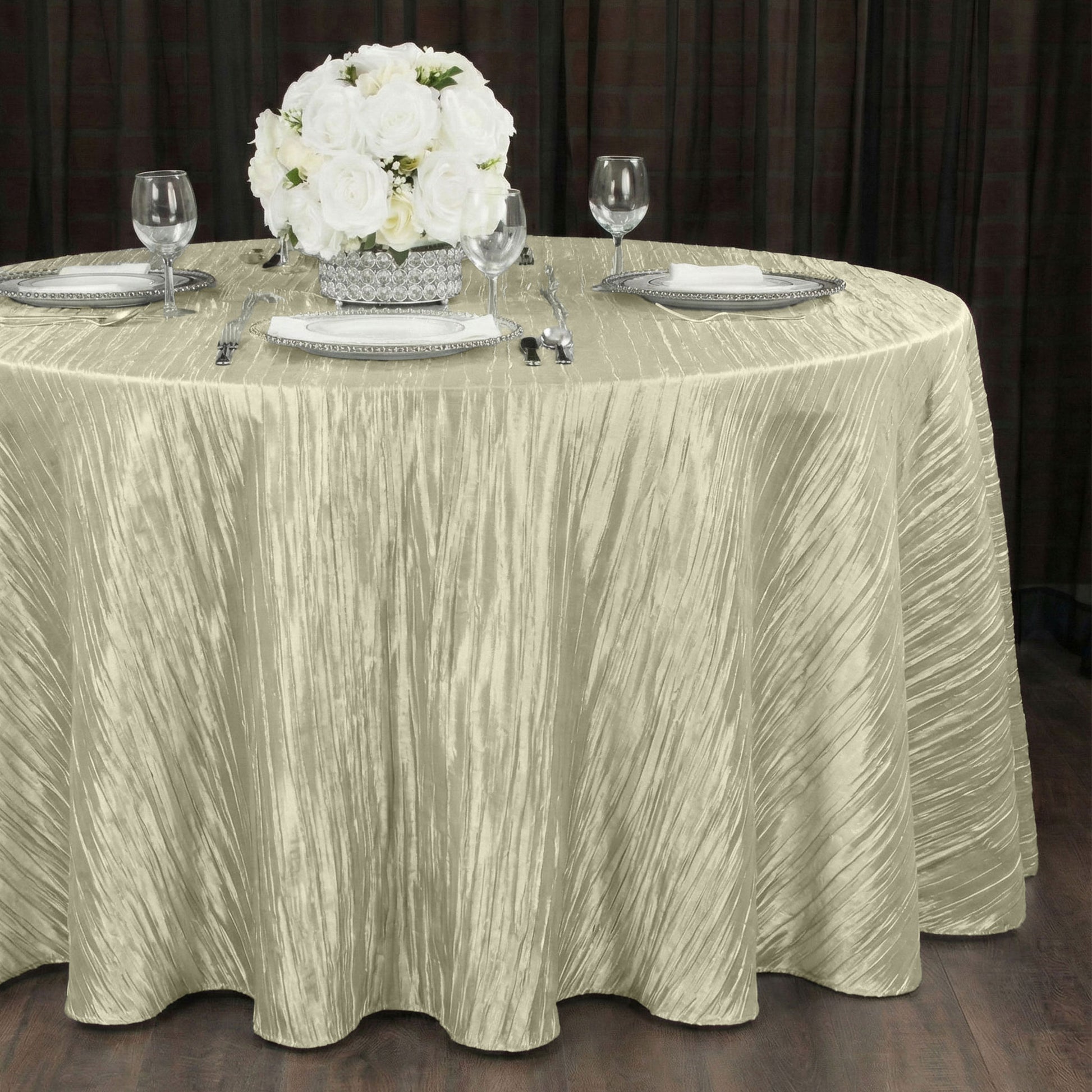 Accordion Crinkle Taffeta 120" Round Tablecloth Greenish Ivory with white florals, charger plates and wine goblets