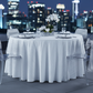 modern rooftop dinner setup using Accordion Crinkle Taffeta 120" Round Tablecloth - White
