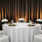 elegant charity dinner setup with Accordion Crinkle Taffeta 120" Round Tablecloth - White
