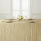 simple setup front view showing Accordion Crinkle Taffeta - 90"x132" Rectangular Tablecloth - Champagne with gold charger plate
