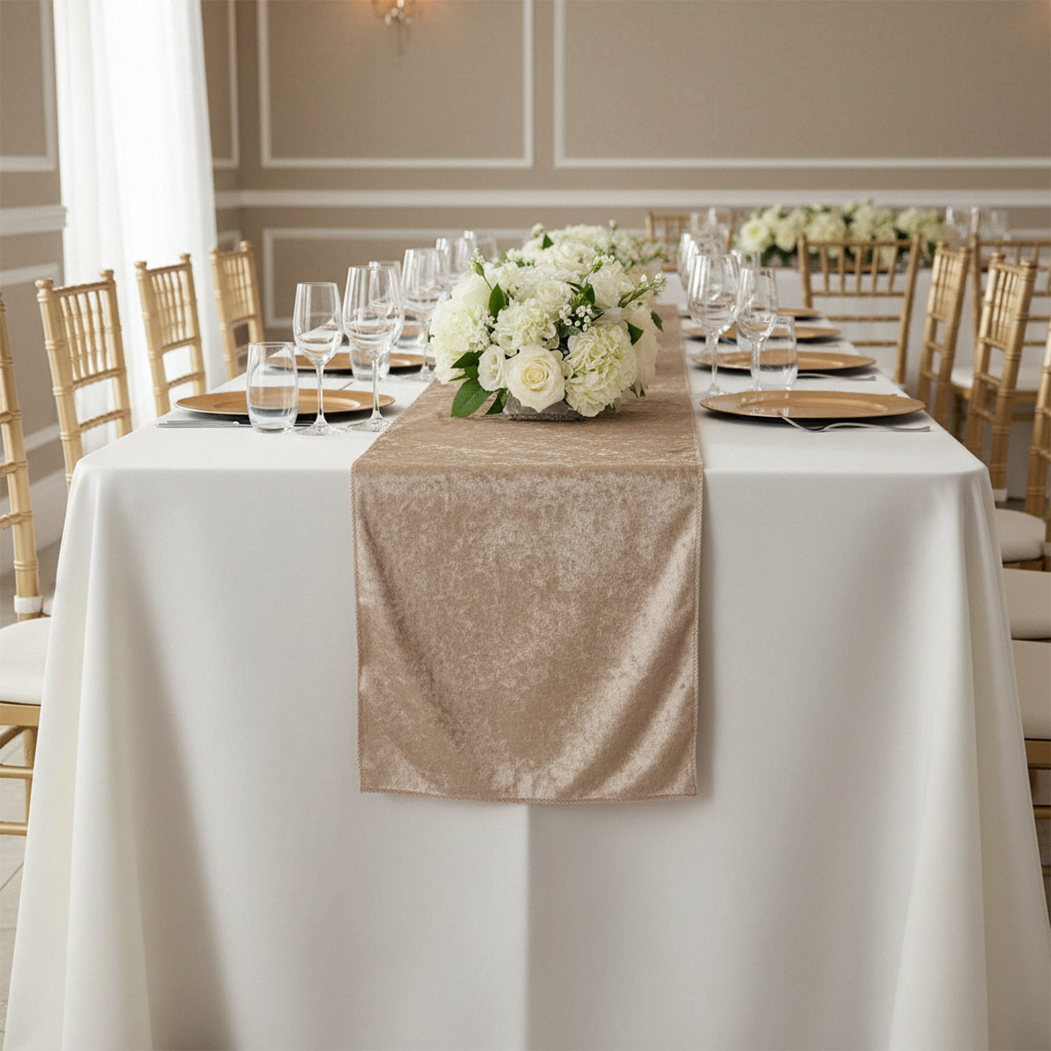 Velvet Table Runner Beige on top a white rectangular tablecloth