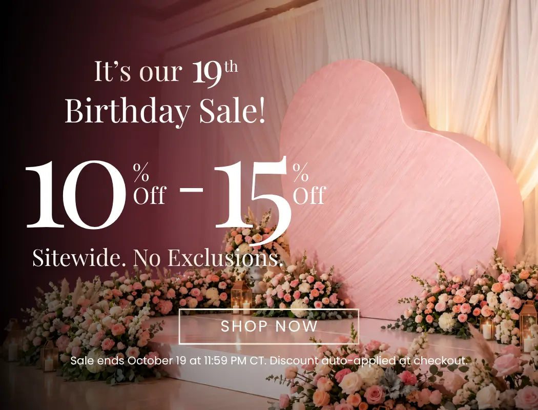 Pink heart backdrop with floral stage announcing a 19th Birthday Sale; 10–15% off sitewide, shop now.