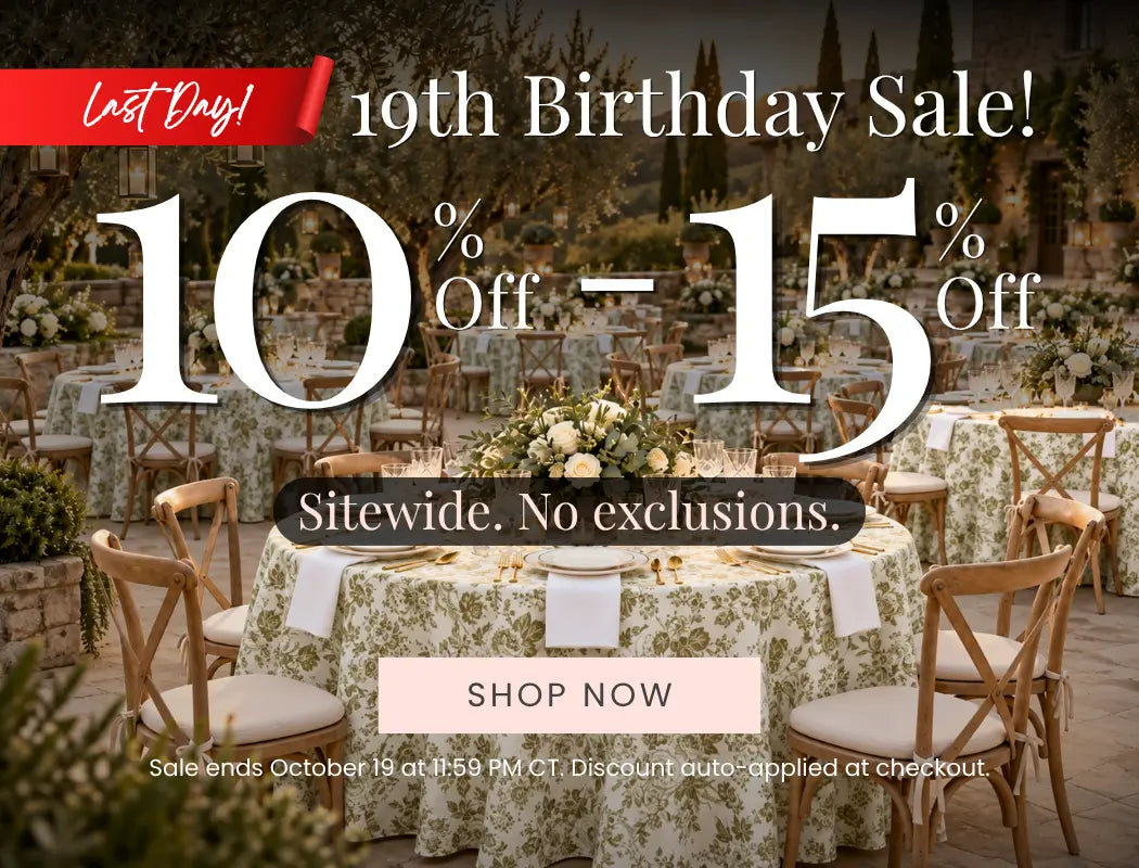 Birthday sale banner over a wedding-style outdoor banquet; floral table linens, 10–15% off sitewide, no exclusions, shop now.