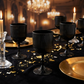 Gold and Black dinner setting with Black Acrylic 11oz Wine Goblets Ripple Design (6 pcs/pk) gold charger plates, gold tapered candles on top a black velvet tablecloth