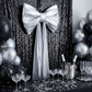 Giant Fabric Bow for Backdrop Metallic Silver against black glitz drape panels
