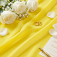 Chiffon Wedding Table Runner 10FT x 27" Canary Yellow close up with wedding bands, cream roses and petals