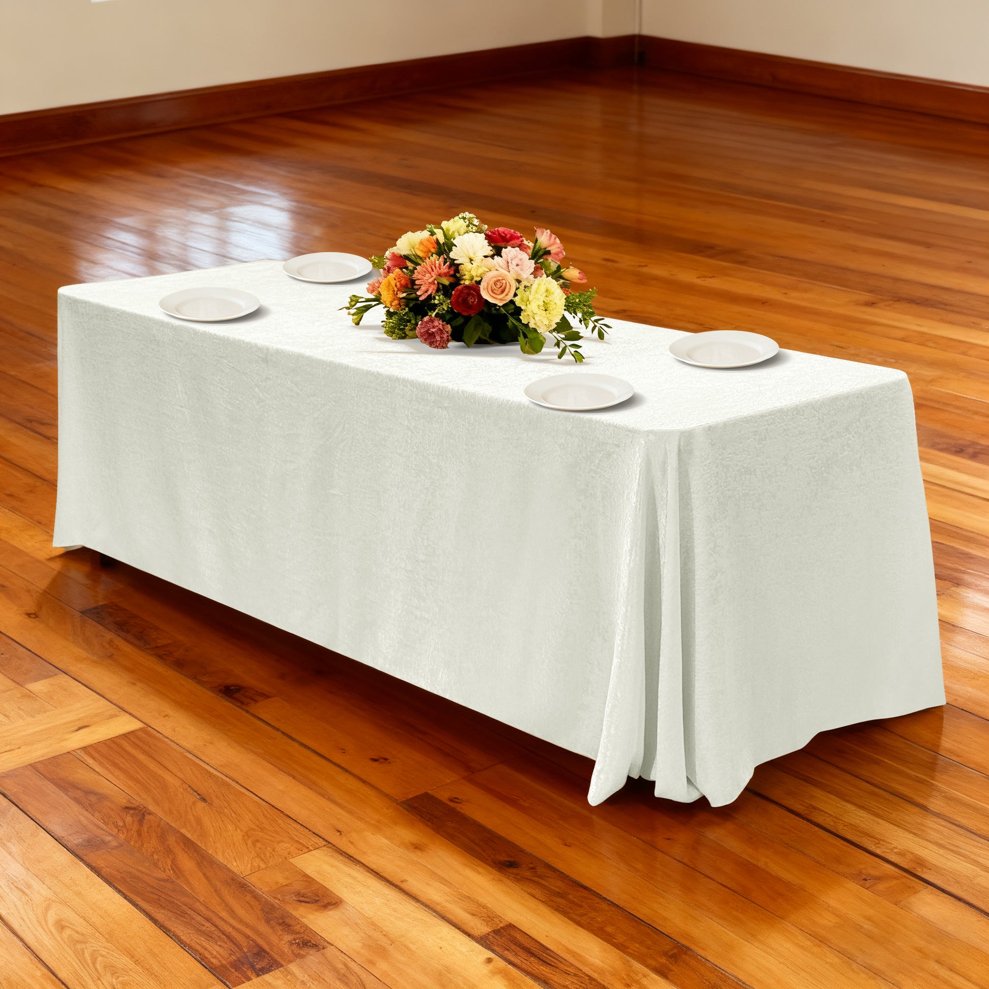 Crinkle Shimmer 90"x156" Rectangular Tablecloth Ivory paired with white dinner plates and mixed floral centerpiece