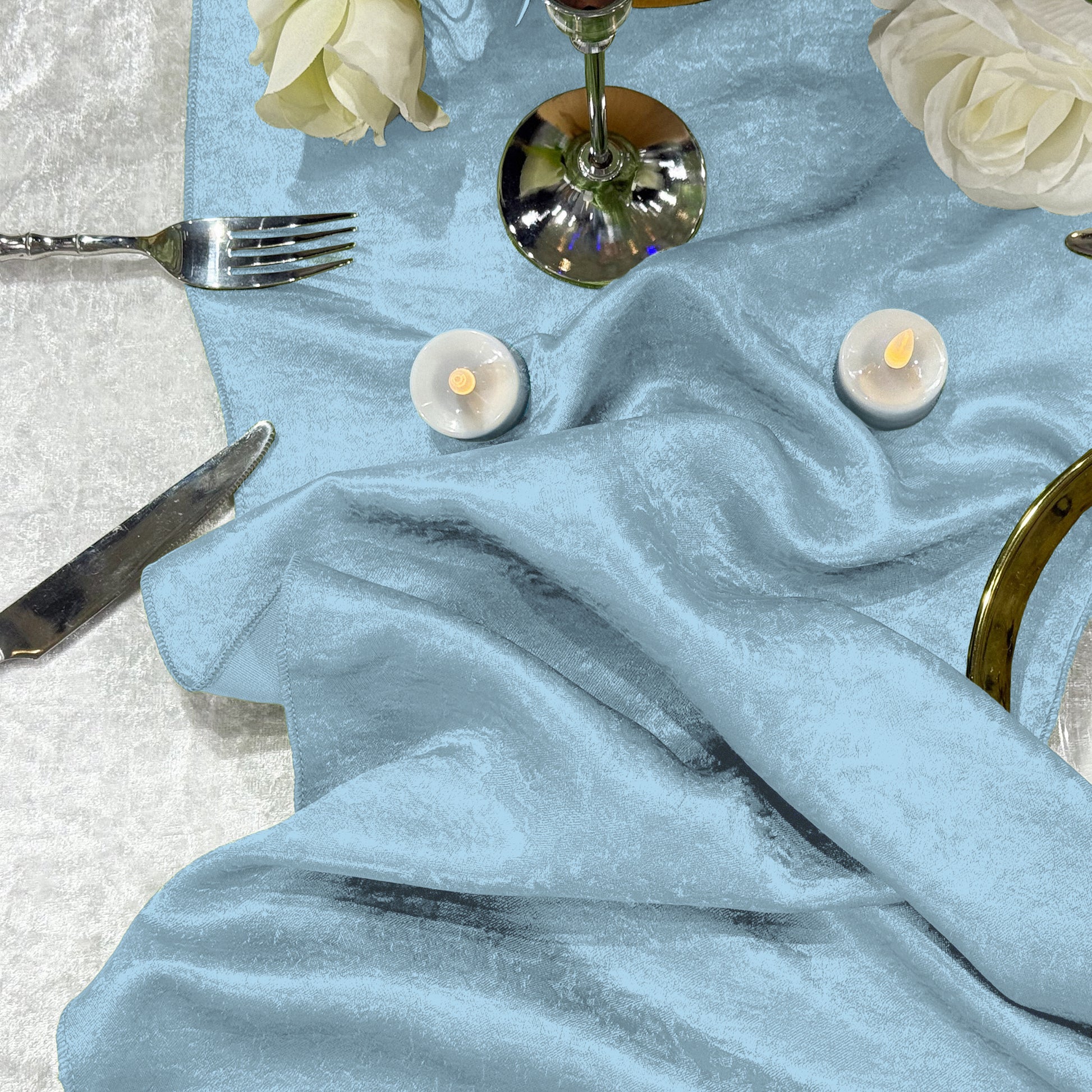 Crinkle Shimmer Table Runner Baby Blue with silveware, LED tea lights and cream roses
