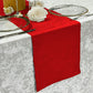 Crinkle Shimmer Table Runner Red on top a velvet silver tablecloth paired with glass charger plates and white roses