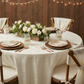 rustic outdoor setup using Crushed Taffeta 120" Round Tablecloth - Ivory with natural tan napkin and plain gold charger plate