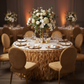 Curly Willow 21ft Table Skirt - Gold with floral centerpiece | gold charger plate | white napkin | glass goblets