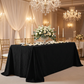 bridal party table setting with the Embossed Geometric Jacquard 90"x156" Rectangle Tablecloth Black, rose petals, tapered candels, dinner plates, and cream roses centerpeice