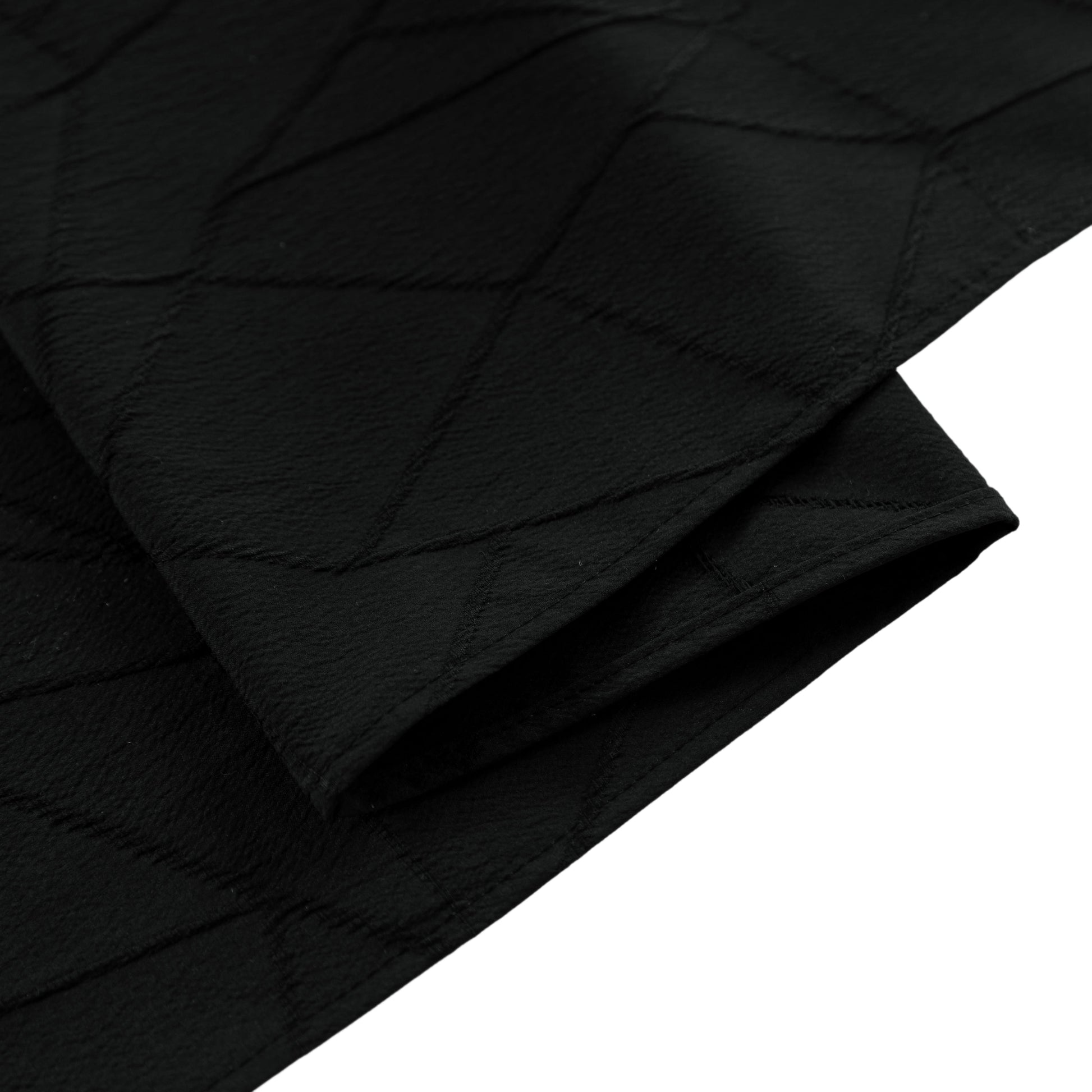 Embossed Geometric Jacquard Table Runner Black hemmed edge close up