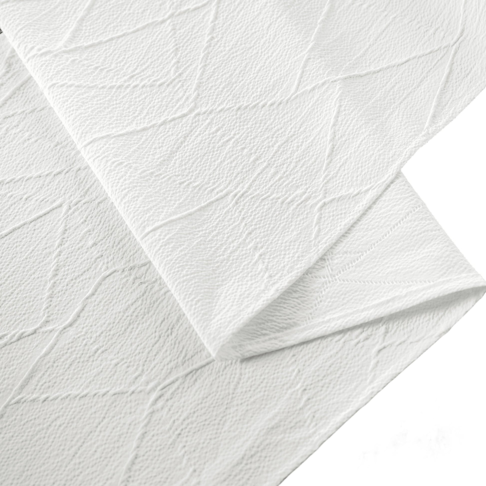 close up of the Embossed Geometric Jacquard Table Runner Light Ivory/Off White hemmed edge