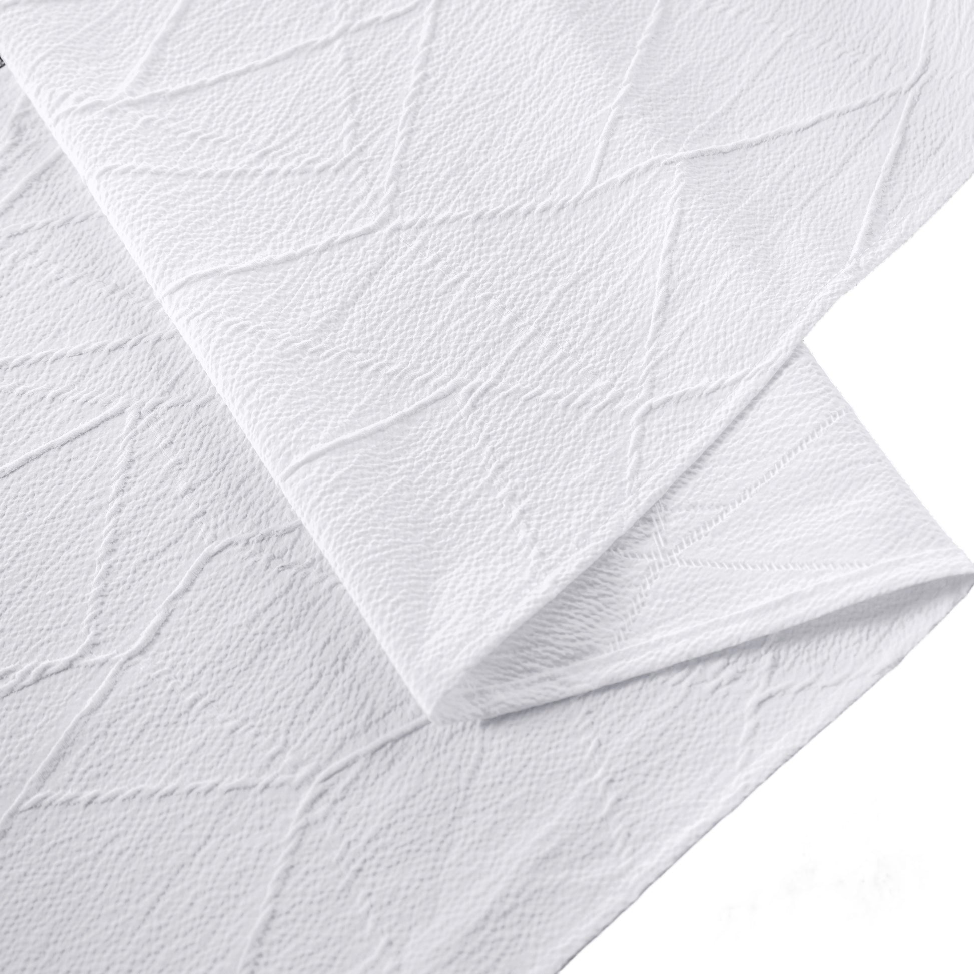 Embossed Geometric Jacquard Table Runner White hemmed edge close up