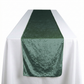 Velvet Table Runner Eucalyptus on top a rectangular white tablecloth
