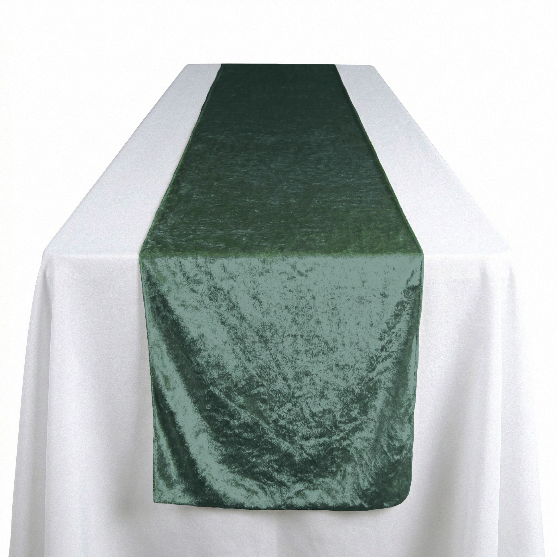 Velvet Table Runner Eucalyptus on top a rectangular white tablecloth
